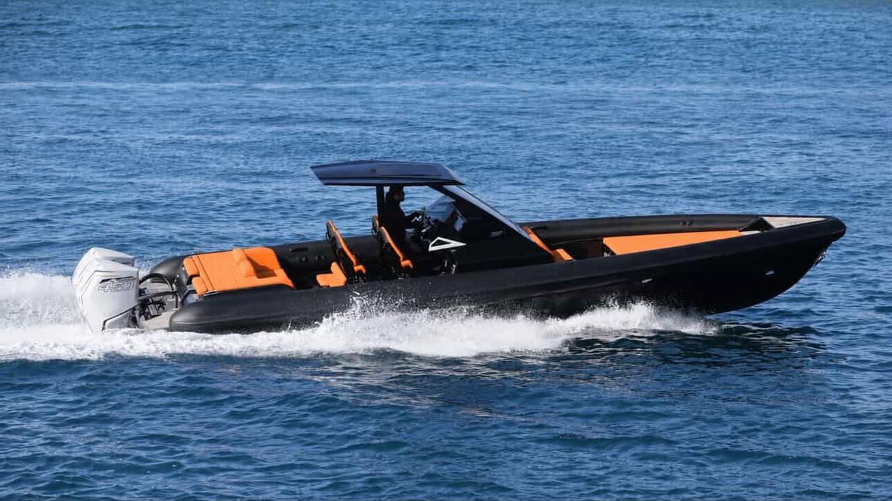 Luxury black and orange Nemo speed boat on the turquoise Saranda sea