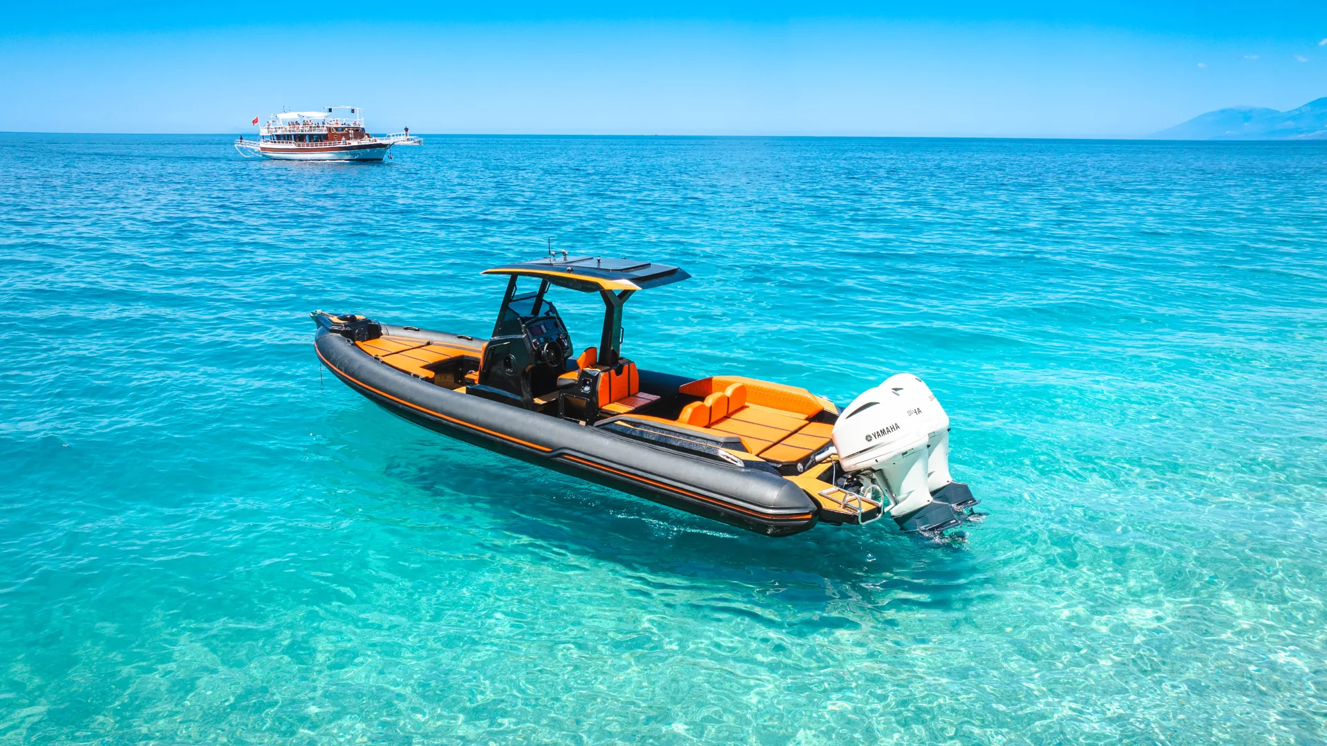 The Nemo Boat in clear turquoise water on the way from Saranda to Ksamil, Albanian Riviera