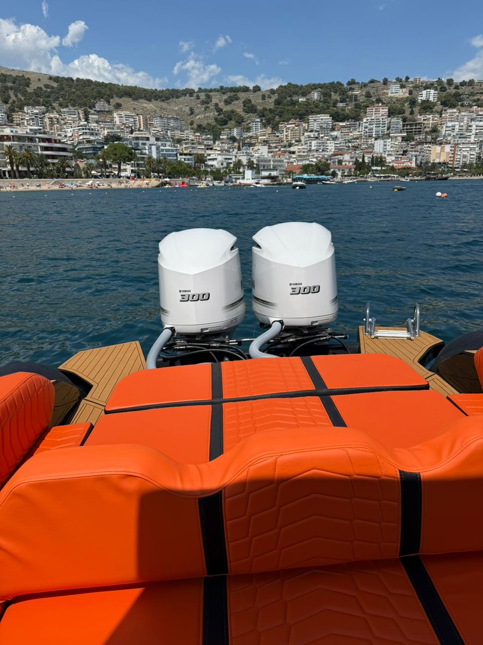 Twin Yamaha 300 HP outboards on the Nemo Boat stern with the Saranda hillside behind